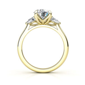 three stone round and pear shaped diamonds yellow gold