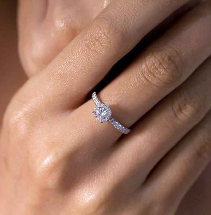 classic engagement ring on finger