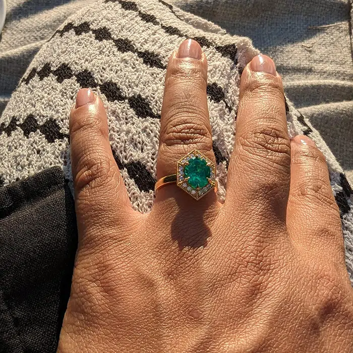 emerald ring on hand