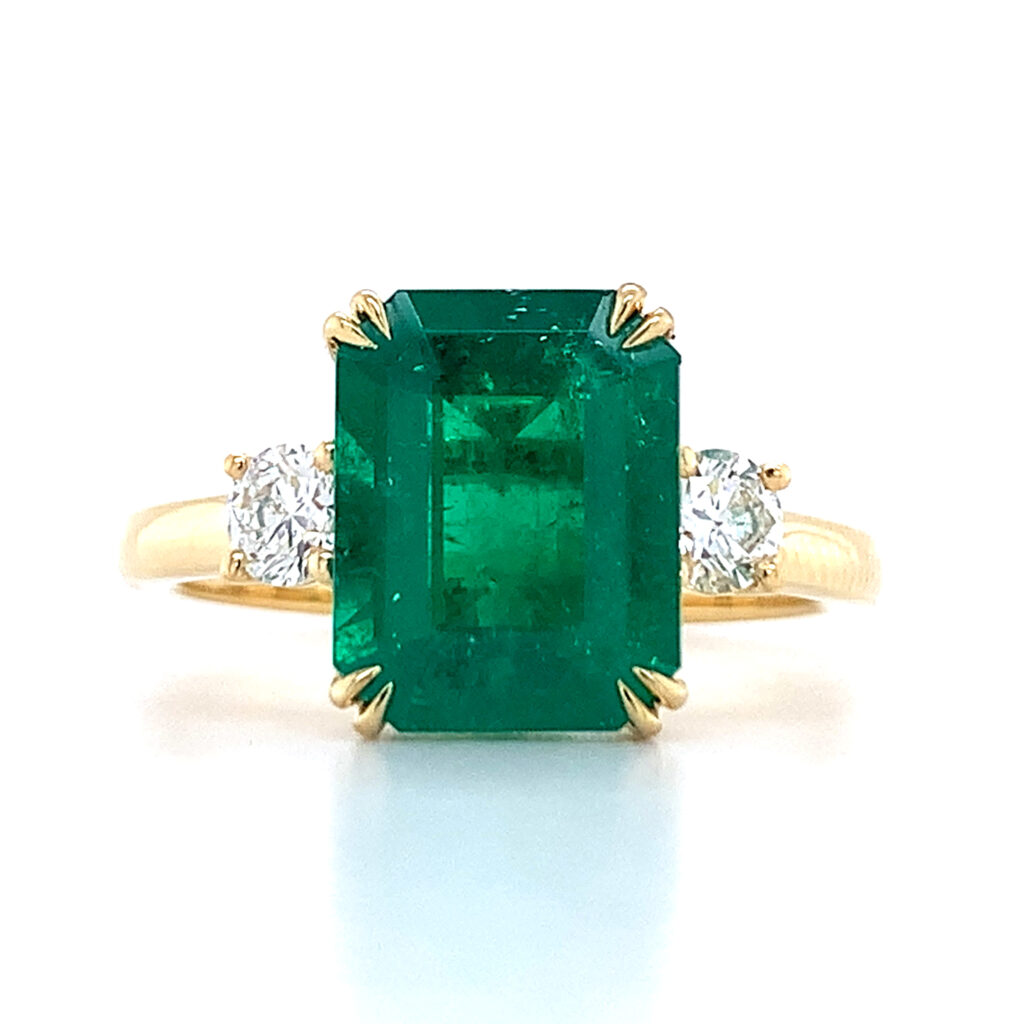 three stone emerald cut emerald gemstone ring